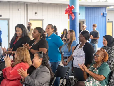 audience members standing and applauding