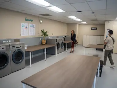 visitors touring a new laundromat