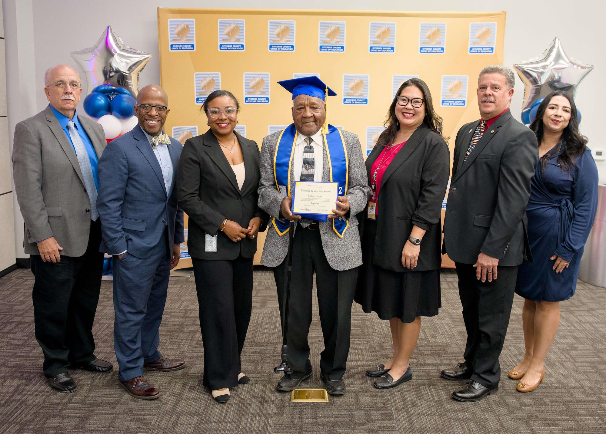 William Daniels and his family receiving his diploma