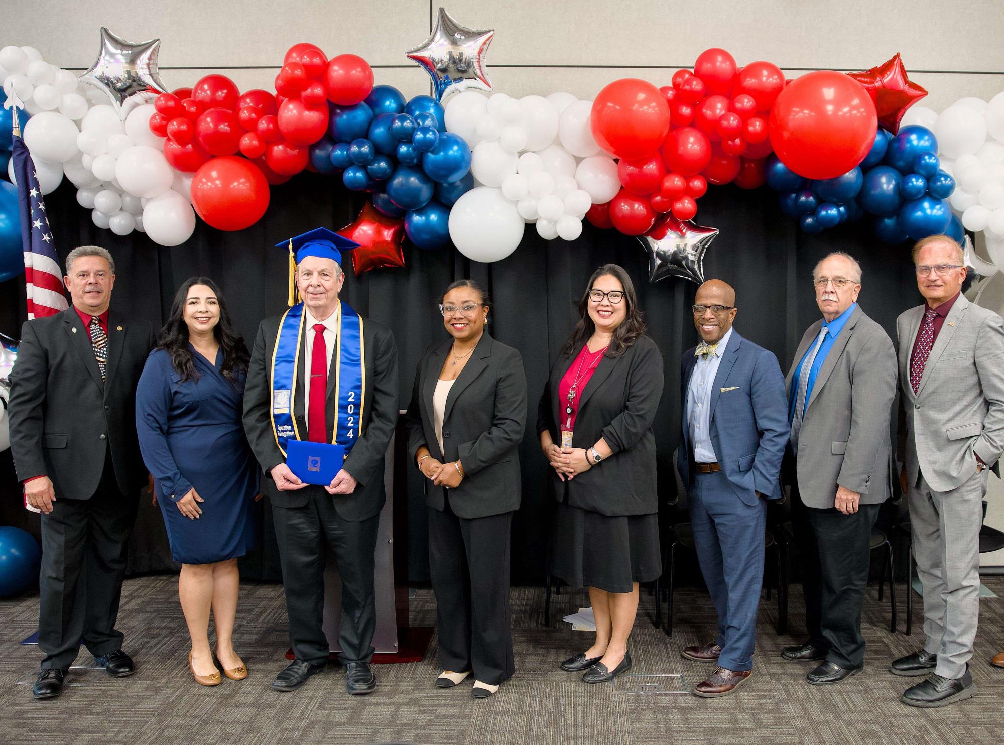 Stephen Tomanelli and his family recieving his diploma